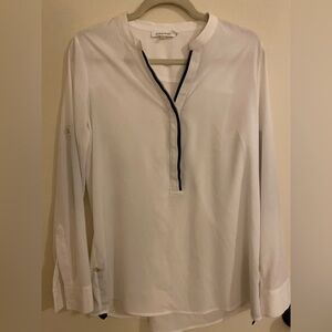 Calvin Klein woman’s white blouse.